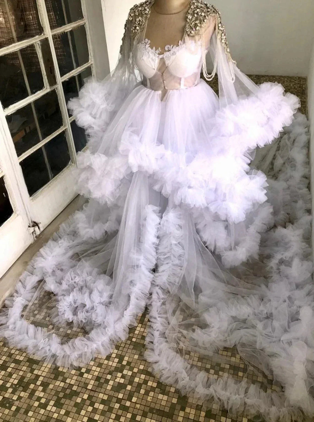Uniquely designed Monarch length lace and yarn puffed floral full sleeve bridal dress