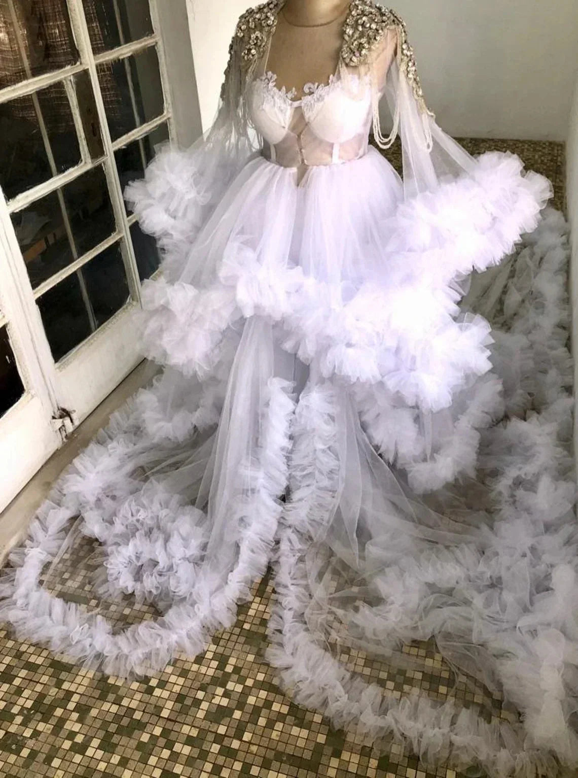 Uniquely designed Monarch length lace and yarn puffed floral full sleeve bridal dress