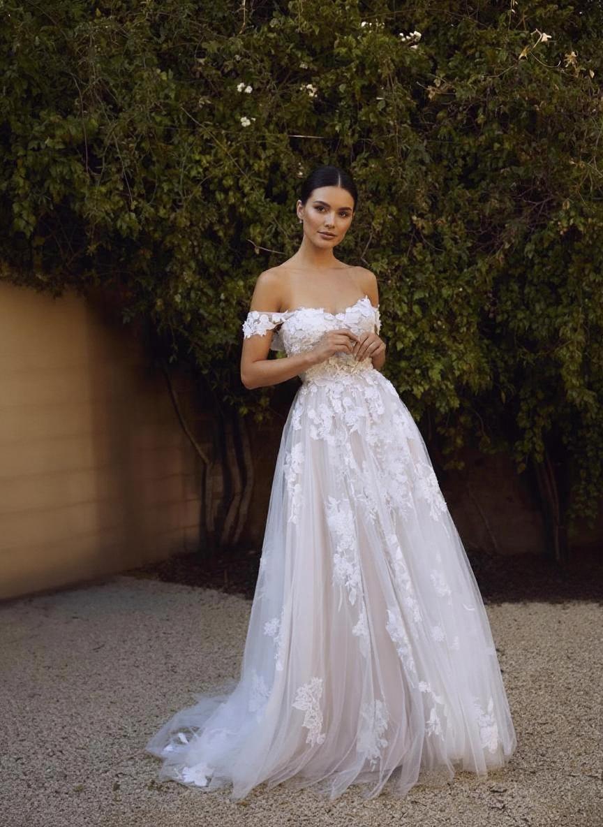 Off the shoulder chapel length lace bridal dress