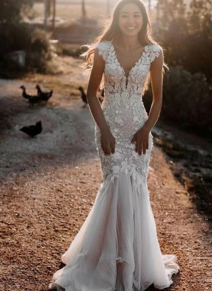 Cathedral length V neck short sleeve lace bridal gown
